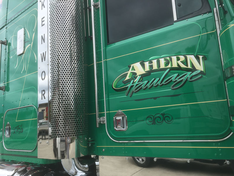 Ahern Haulage script lettering on a green Kenworth door